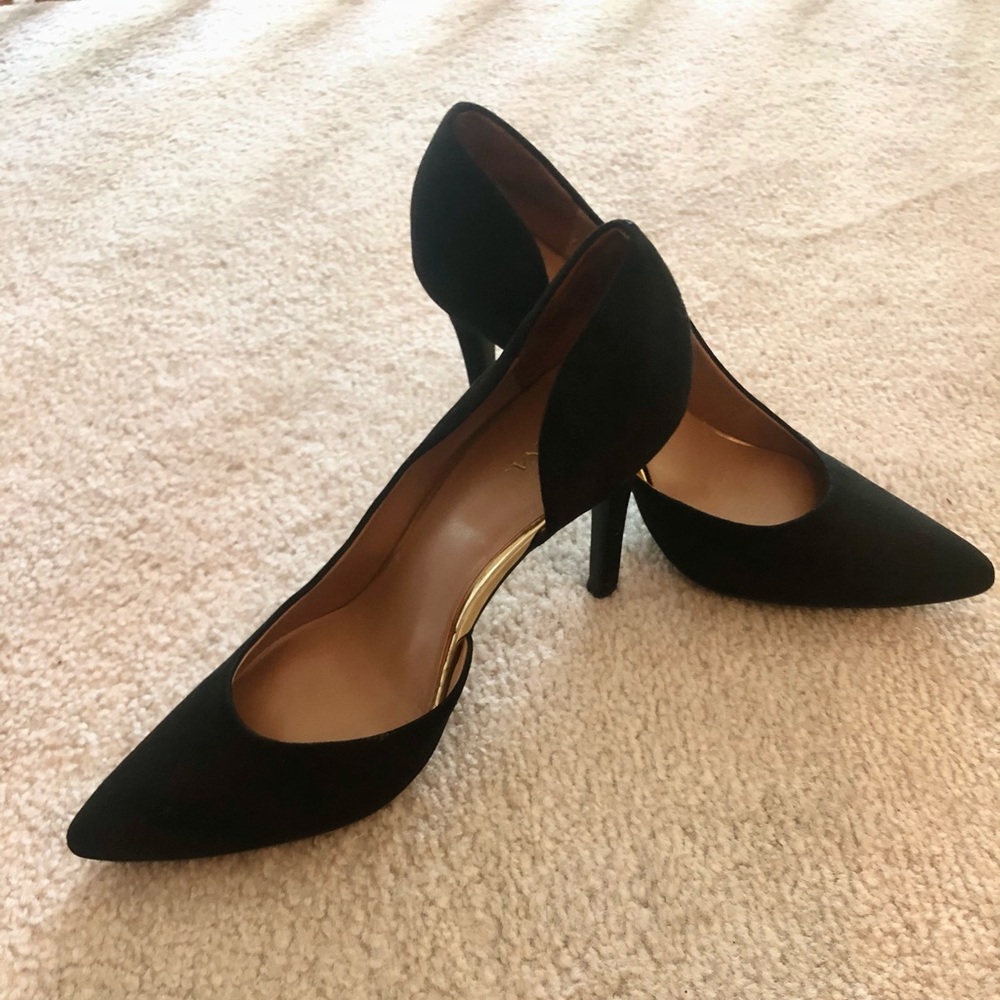 Black heels with gold accents